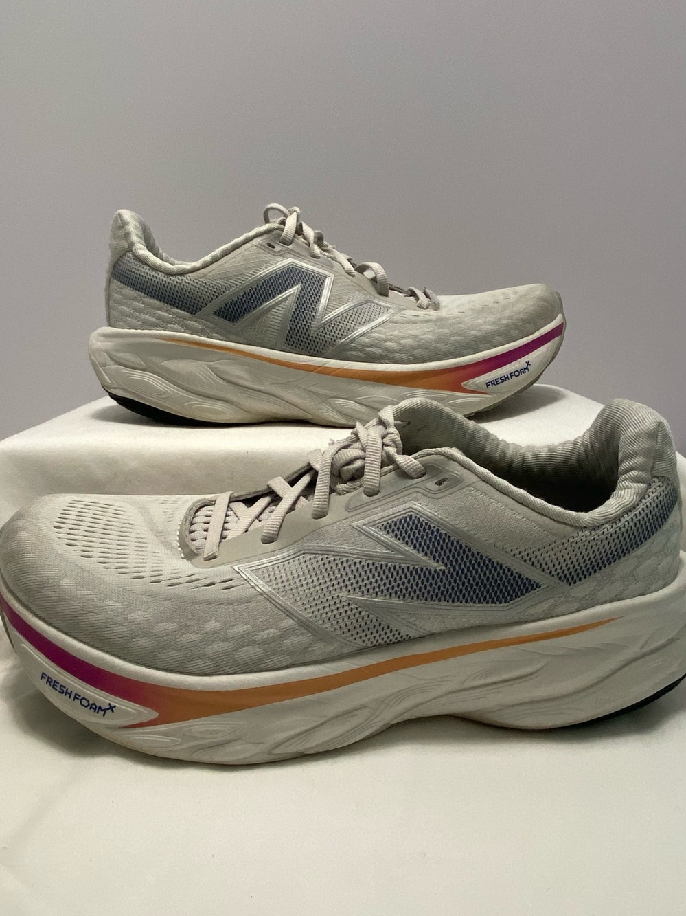 New Balance Women's Light Gray Athletic Shoes with Pink and Gold Accent
